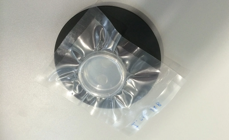 Fig. 2: The artificial corneas and their integral supporting scaffolds are suspended in a transparent gel and sealed in clear plastic blister packs.