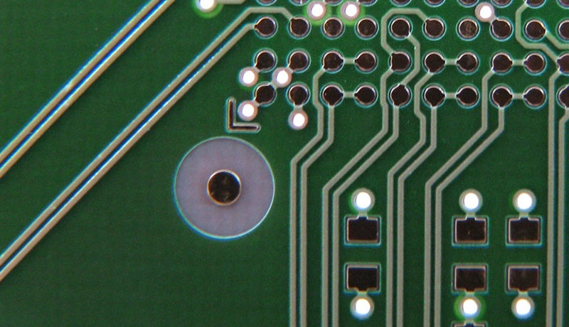 Optical inspection application for a PCB coating system: The vision system reads barcodes and plain text on the objects (OCR), as well as determining the position and location of fiducials.